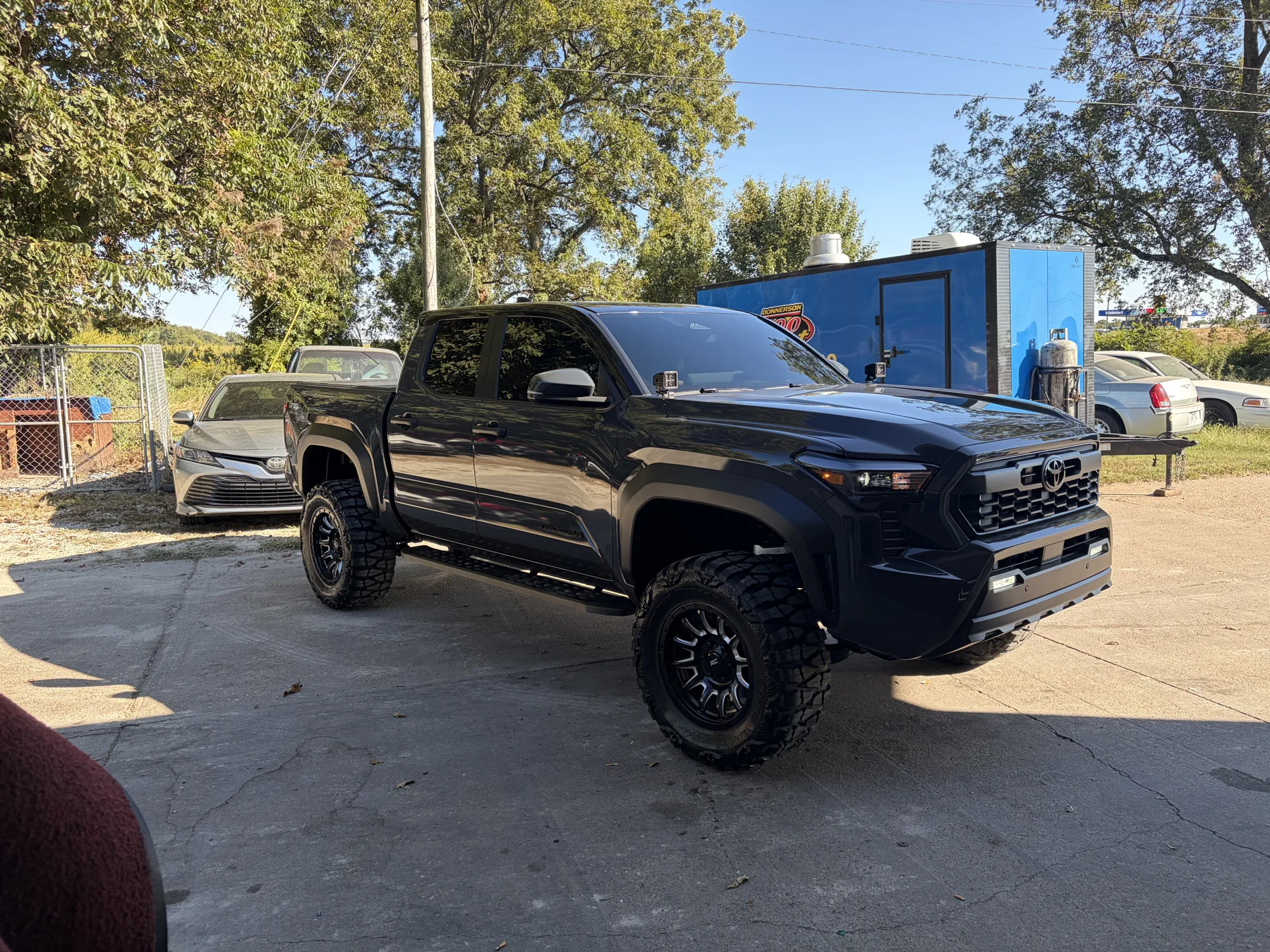 Black GMC truck outside Shine Detail Exclusive